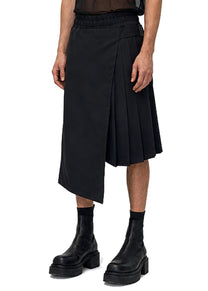 ASYMMETRIC PLEAT SHORTS