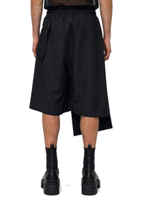 ASYMMETRIC PLEAT SHORTS